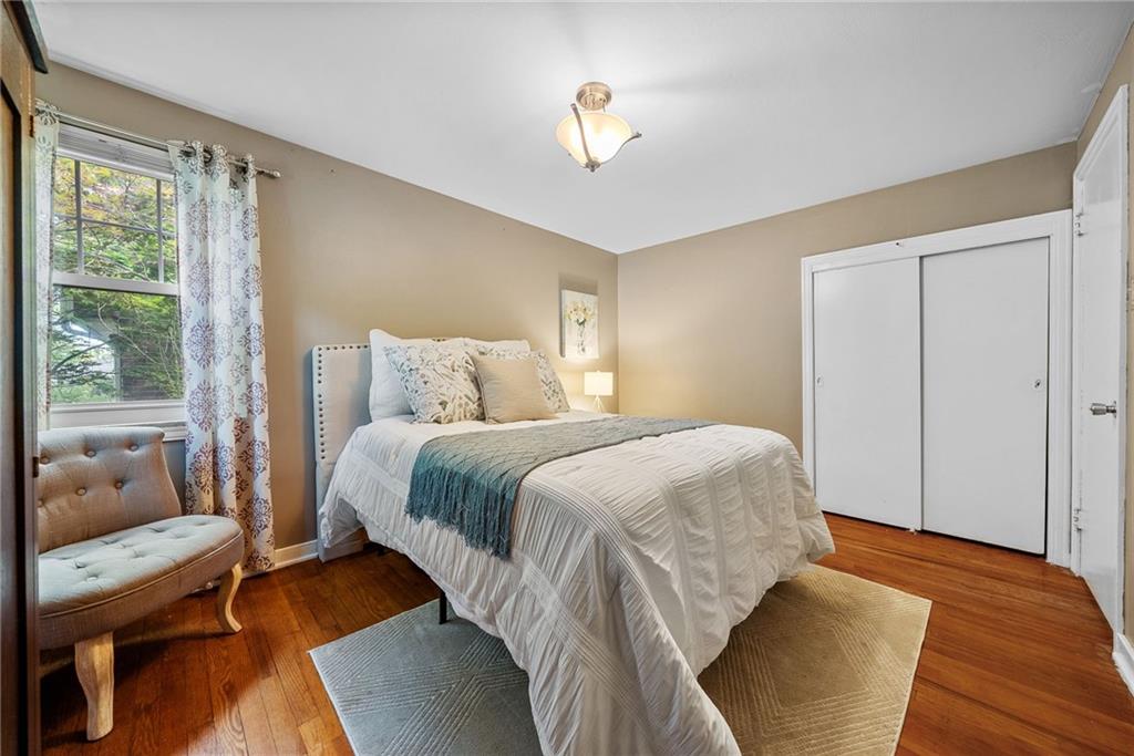 472 Sleepy Hollow Road Pittsburgh, PA 15228 - Photo 25 of 40 a bedroom with a bed and wooden floor