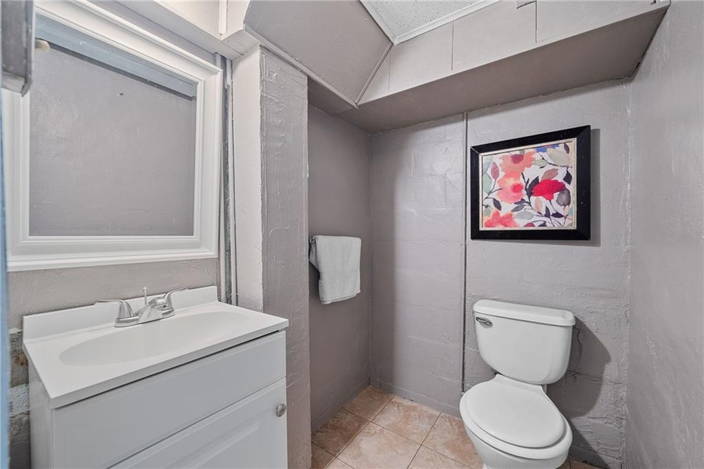 472 Sleepy Hollow Road Pittsburgh, PA 15228 - Photo 33 of 40 a bathroom with a toilet sink and mirror