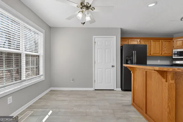 a view of a kitchen with a sink and cabinet area