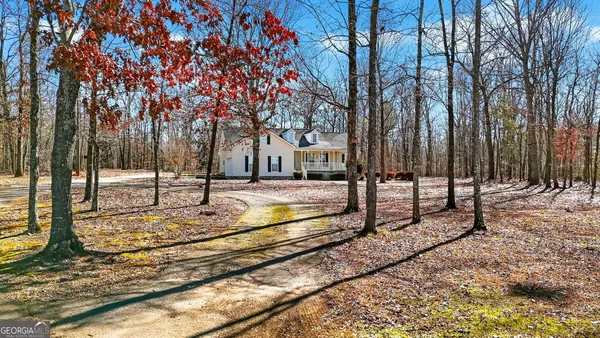 a view of a yard with snow on the road