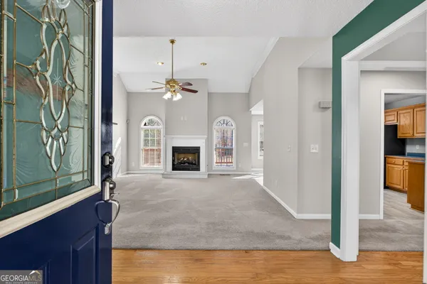 a view of a livingroom with a fireplace and cabinet