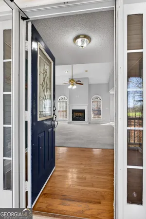 a view of living room with furniture and window