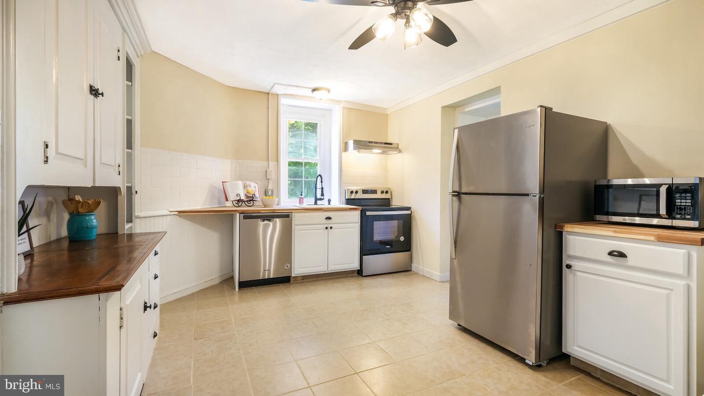 a kitchen with a refrigerator a sink and dishwasher