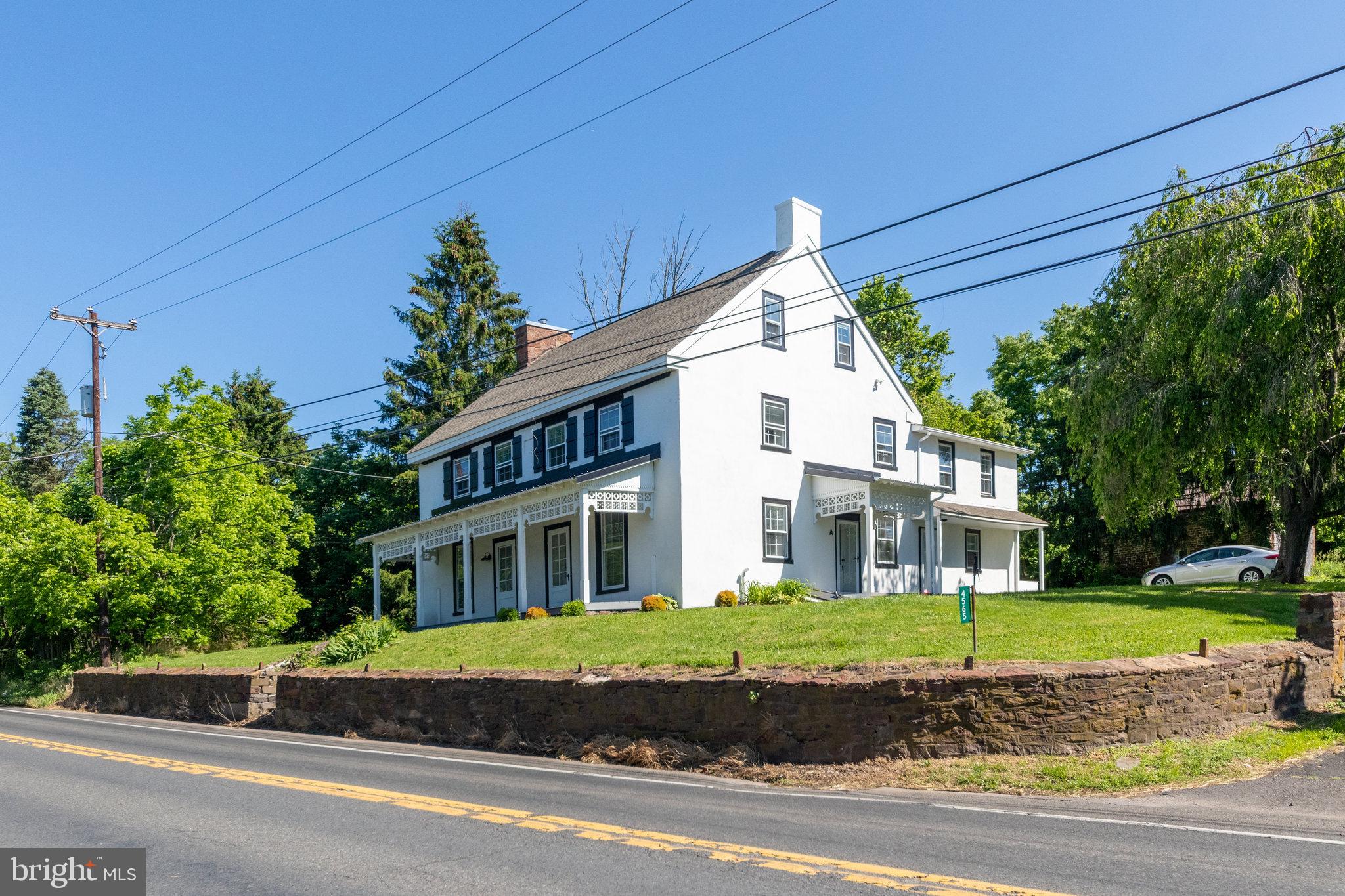 4564 Durham Road, Unit B Doylestown, PA 18902 - Photo 12 of 13 a front view of a house with a garden