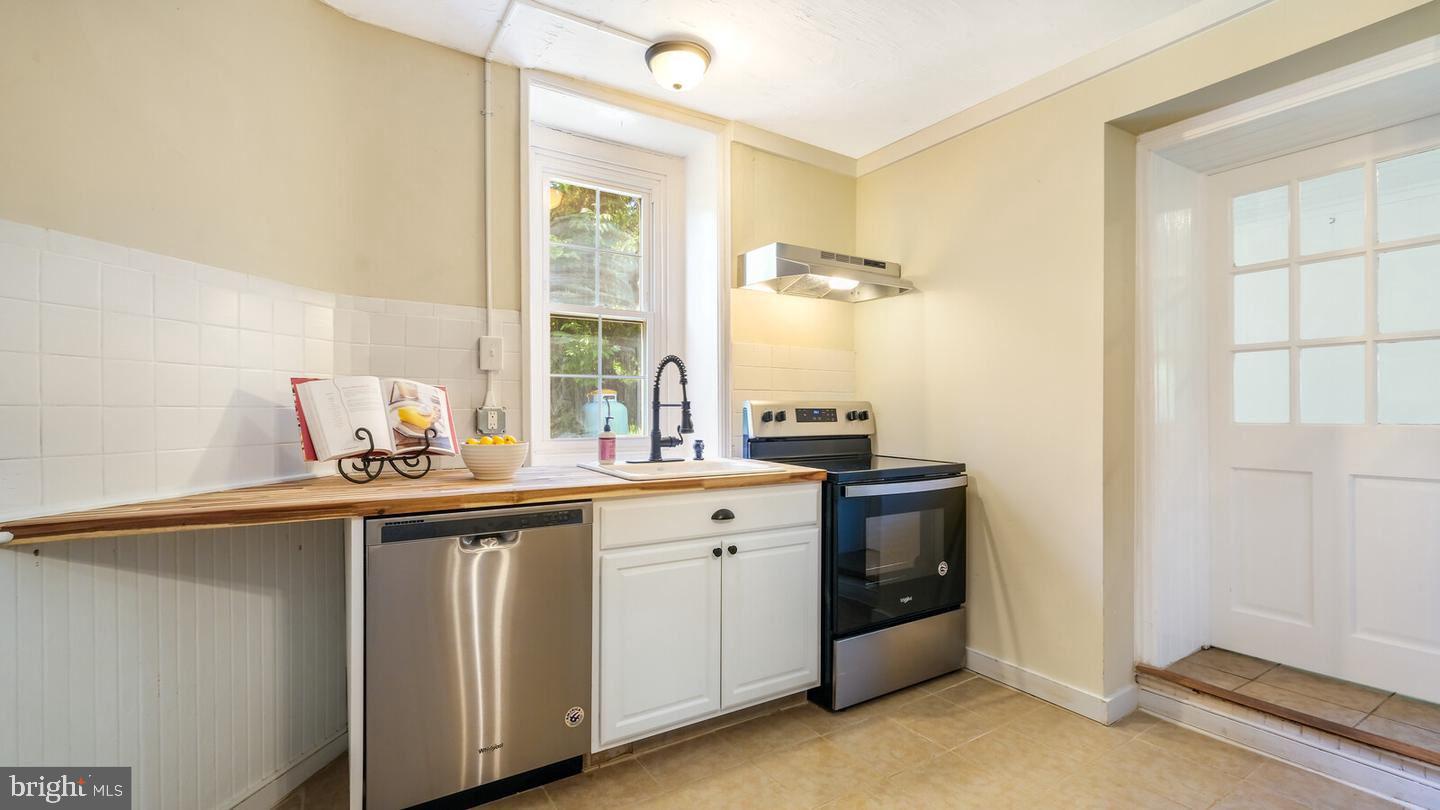 4564 Durham Road, Unit B Doylestown, PA 18902 - Photo 4 of 13 a kitchen with a sink and cabinets