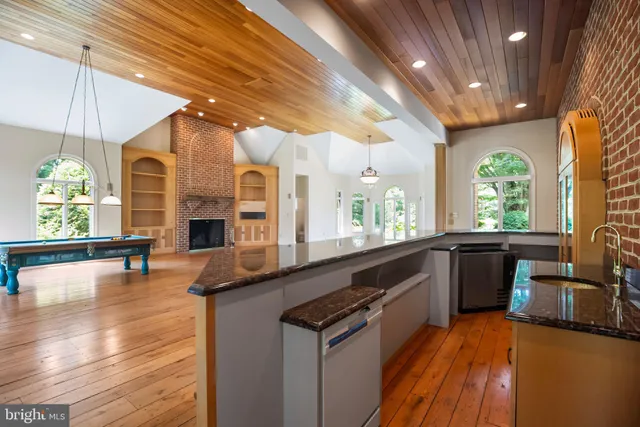 a workspace with wooden floor and a window