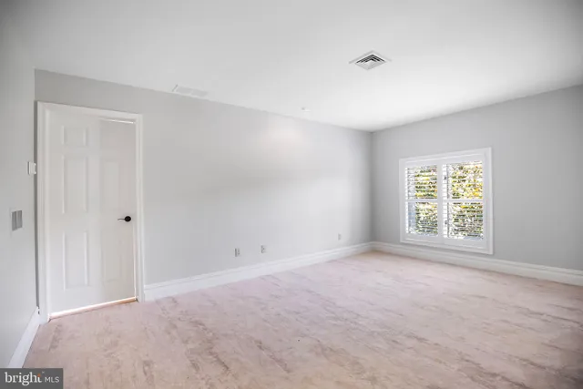 a view of a hallway with staircase