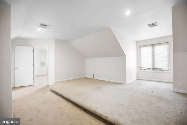 a bathroom with a shower and a toilet