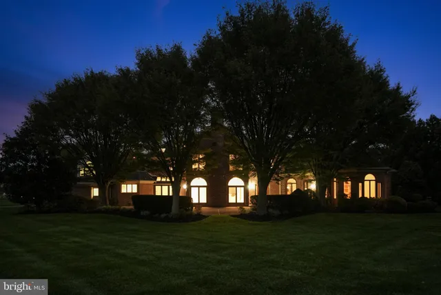 a view of a yard and front view of sunset