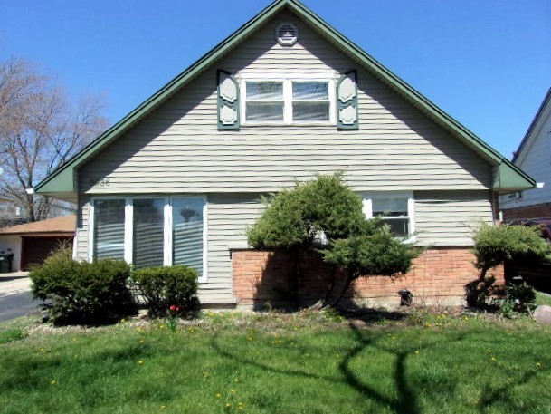 3936 169th Street Country Club Hills, IL 60478 - Photo 1 of 11 a front view of a house with a yard