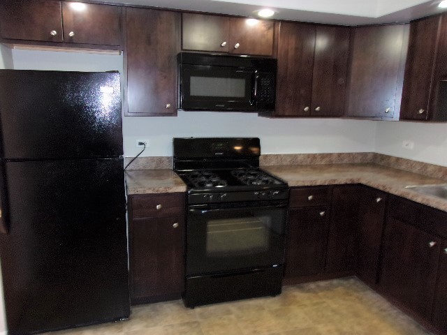 3936 169th Street Country Club Hills, IL 60478 - Photo 2 of 11 a kitchen with a sink and a stove top oven