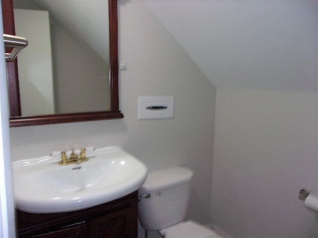 3936 169th Street Country Club Hills, IL 60478 - Photo 11 of 11 a bathroom with a sink a toilet and mirror