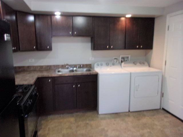 3936 169th Street Country Club Hills, IL 60478 - Photo 3 of 11 a kitchen with a sink and cabinets