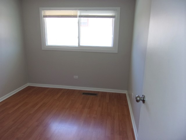 3936 169th Street Country Club Hills, IL 60478 - Photo 7 of 11 an empty room with a window