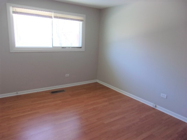 3936 169th Street Country Club Hills, IL 60478 - Photo 8 of 11 an empty room with a window