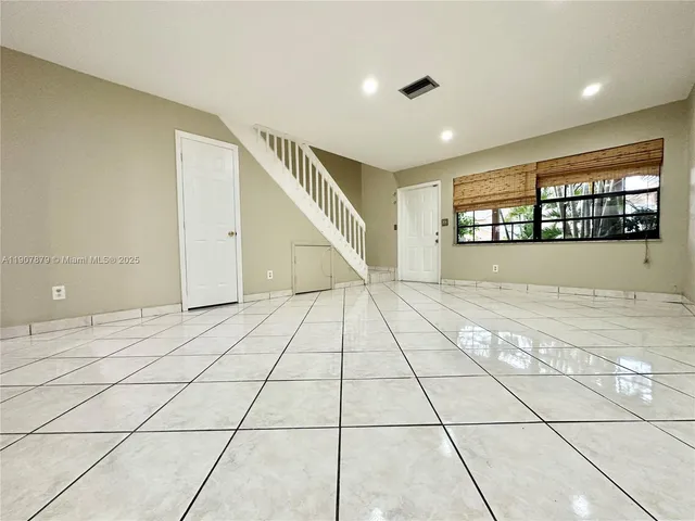 a view of an empty room and window