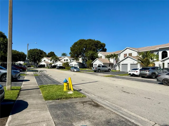 a kitchen with stainless steel appliances granite countertop a refrigerator sink and cabinets