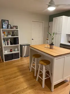 a kitchen with a table and chairs