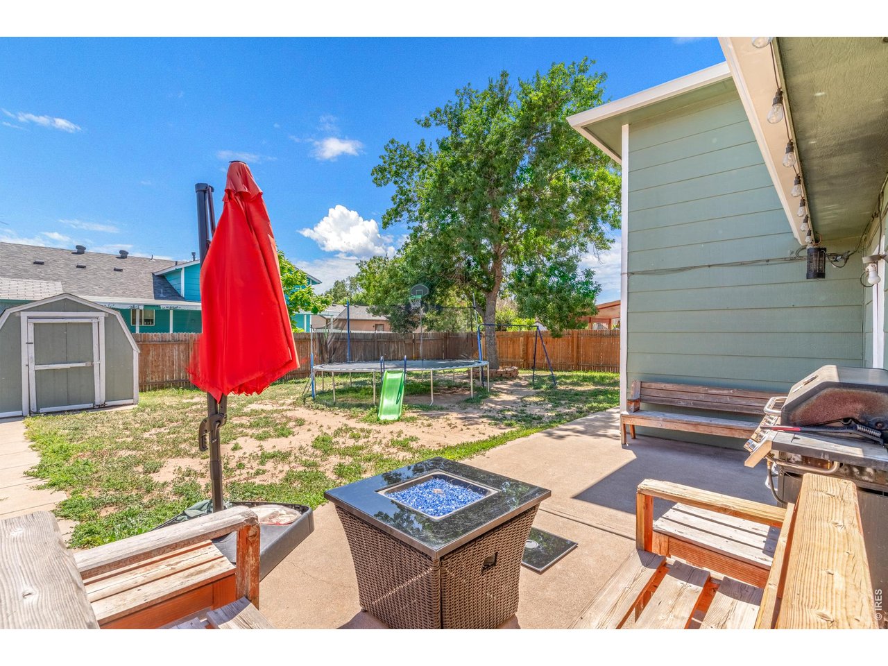 526 East 23rd Street Road Greeley, CO 80631 - Photo 15 of 20 a view of a backyard with sitting area