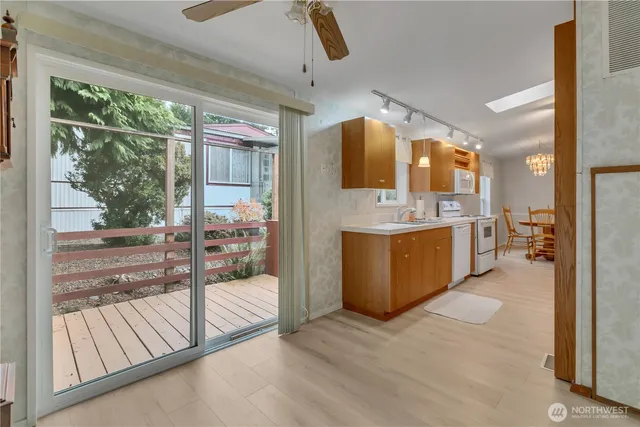 a kitchen with stainless steel appliances granite countertop a stove and a refrigerator