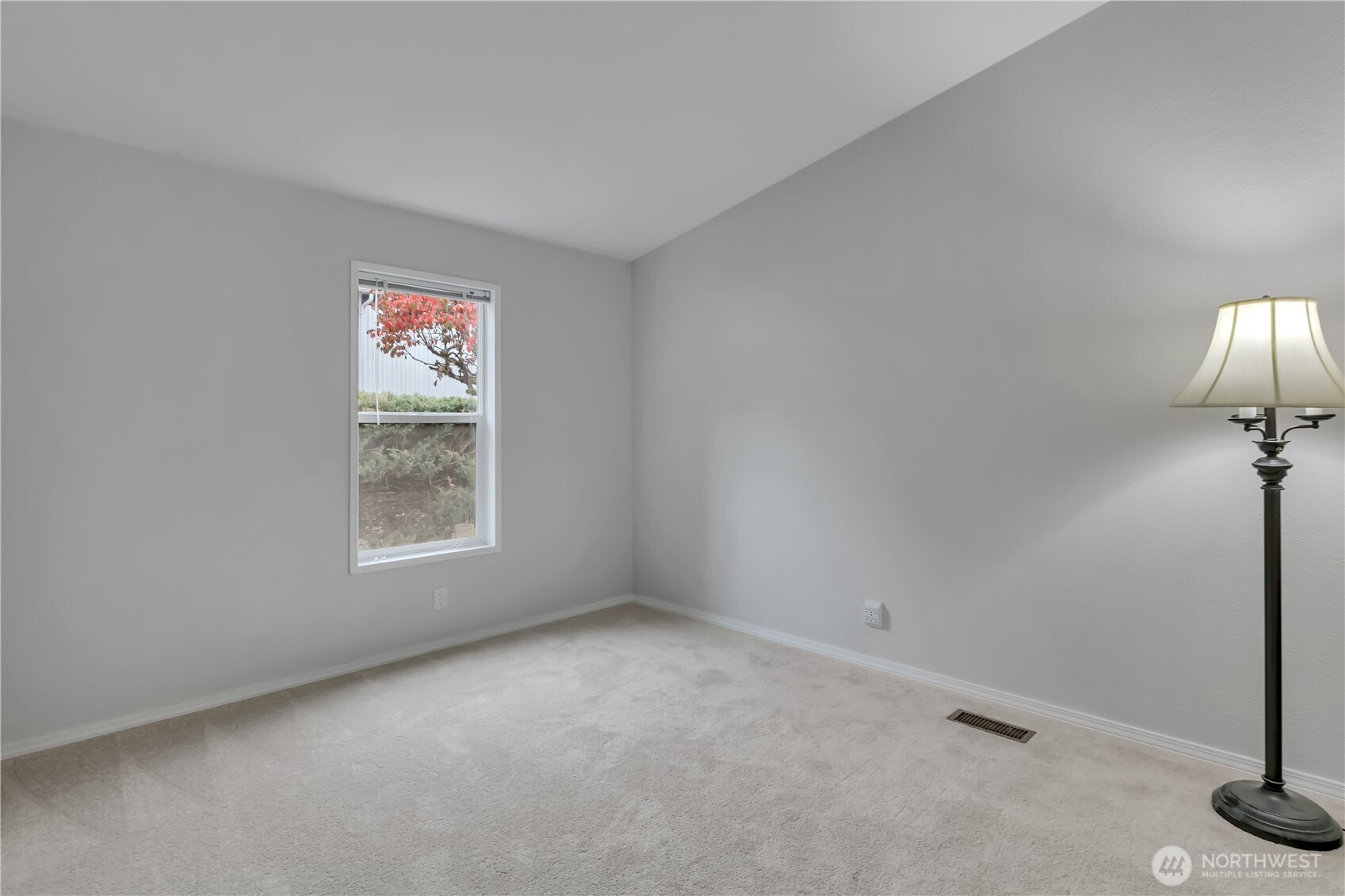 2200 196th Street Southeast, Unit 66 Bothell, WA 98012 - Photo 18 of 26 a view of an empty room with a window