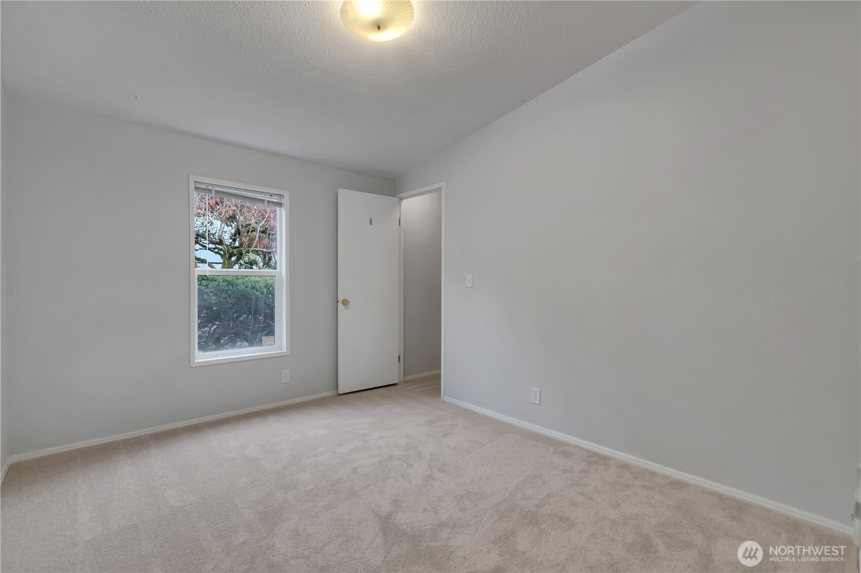 2200 196th Street Southeast, Unit 66 Bothell, WA 98012 - Photo 19 of 26 an empty room with windows