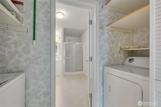 a bathroom with a washer and dryer