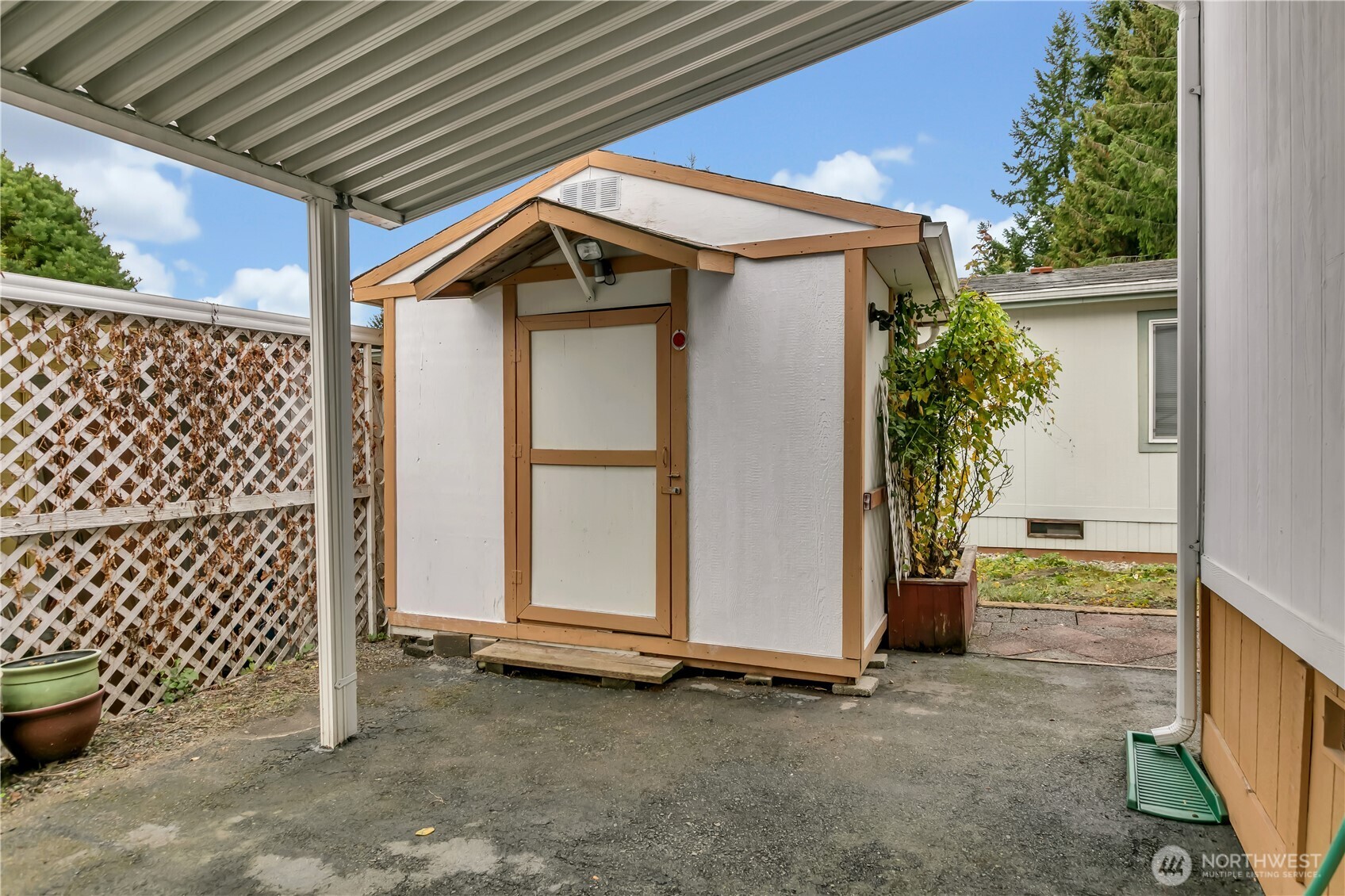 2200 196th Street Southeast, Unit 66 Bothell, WA 98012 - Photo 26 of 26 a backyard of a house with potted plants