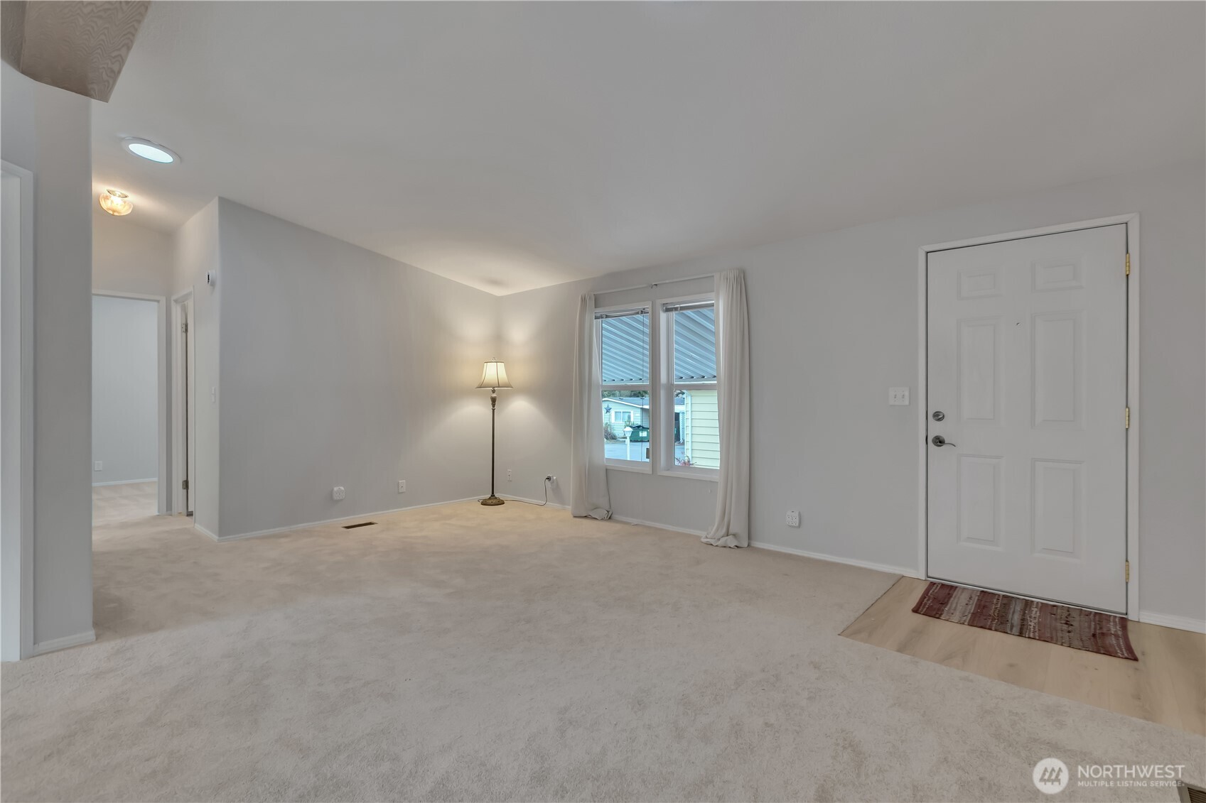 2200 196th Street Southeast, Unit 66 Bothell, WA 98012 - Photo 5 of 26 a view of an empty room with a window