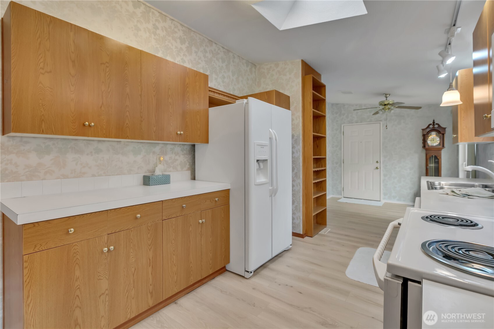 2200 196th Street Southeast, Unit 66 Bothell, WA 98012 - Photo 9 of 26 a kitchen with a refrigerator and a stove