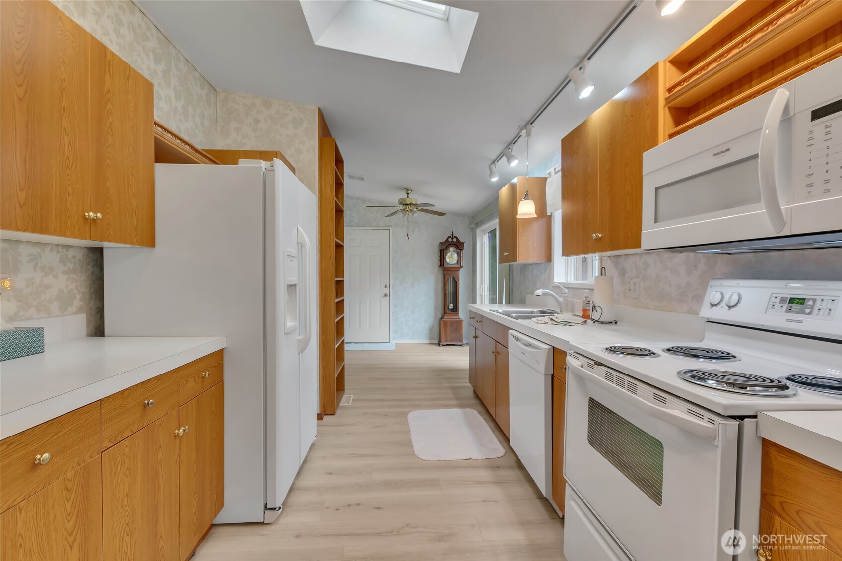 2200 196th Street Southeast, Unit 66 Bothell, WA 98012 - Photo 10 of 26 a kitchen with stainless steel appliances a stove a sink and a refrigerator