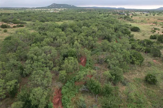 an aerial view of residential houses and outdoor space