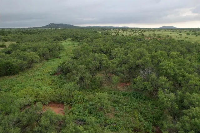 a view of a field with an outdoor space