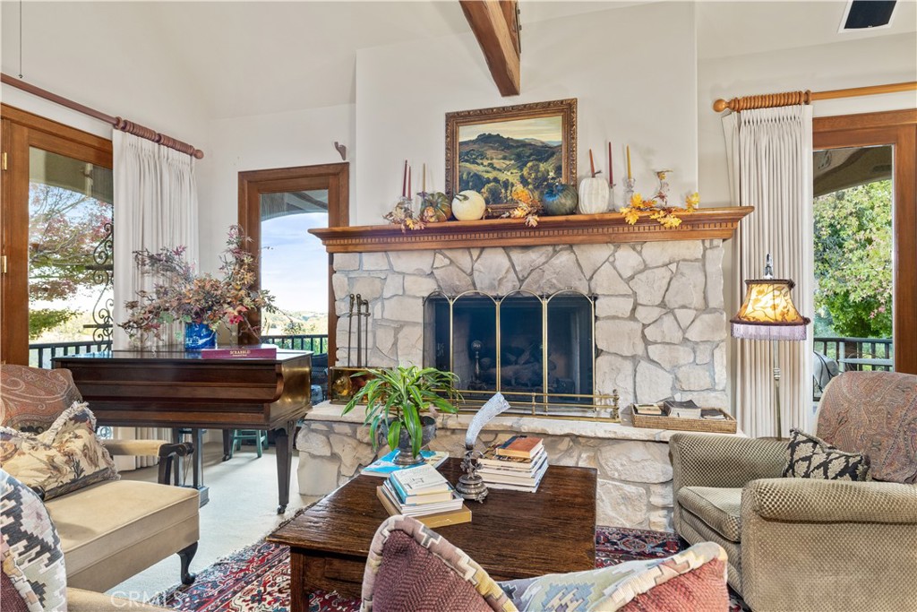 5415 Fairhills Road Paso Robles, CA 93446 - Photo 15 of 73 Living room with stunning fireplace and lots of windows to let in the natural light.