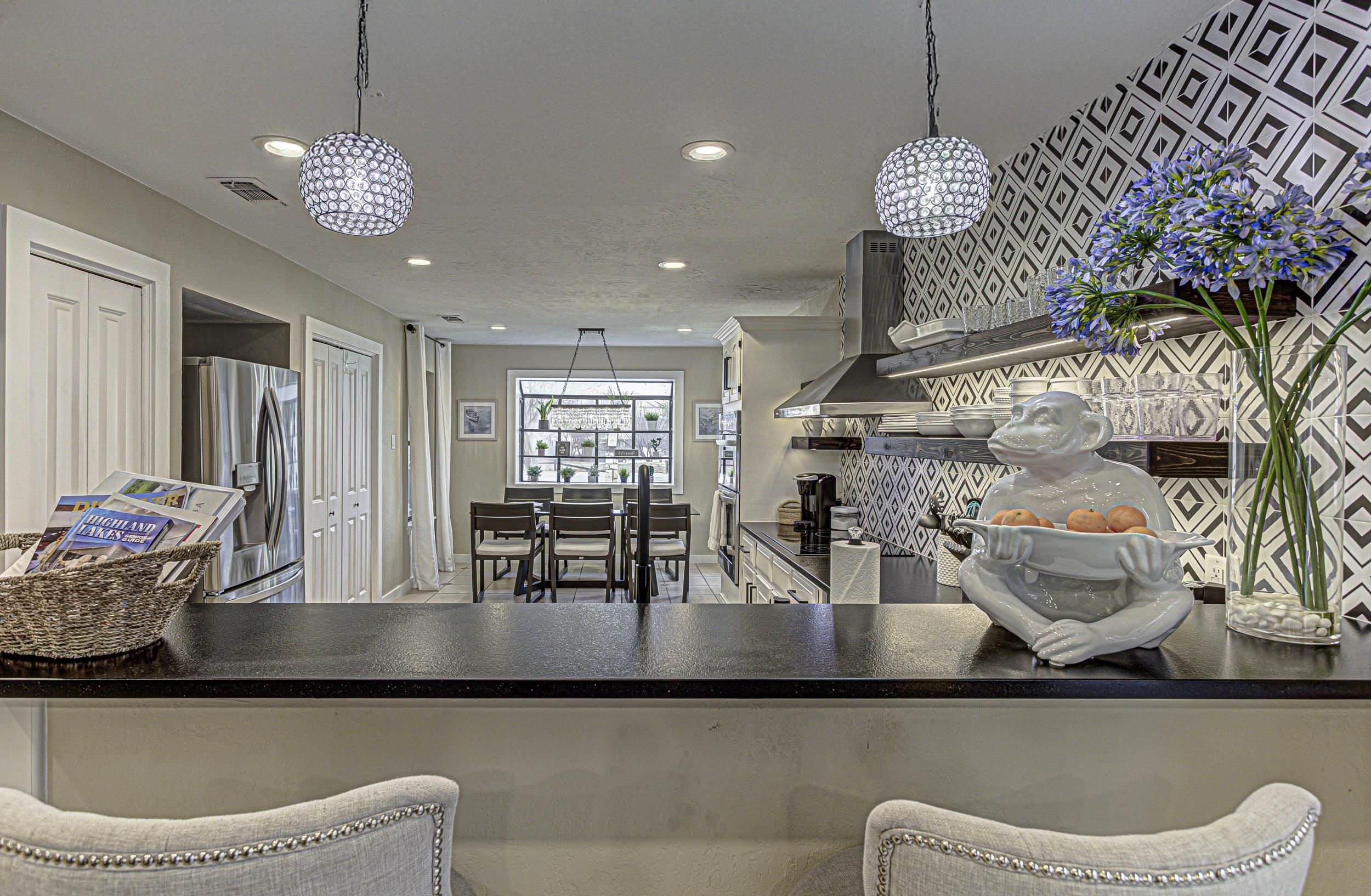103 Oasis, Unit A Horseshoe Bay, TX 78657 - Photo 12 of 30 a lobby with furniture and chandelier