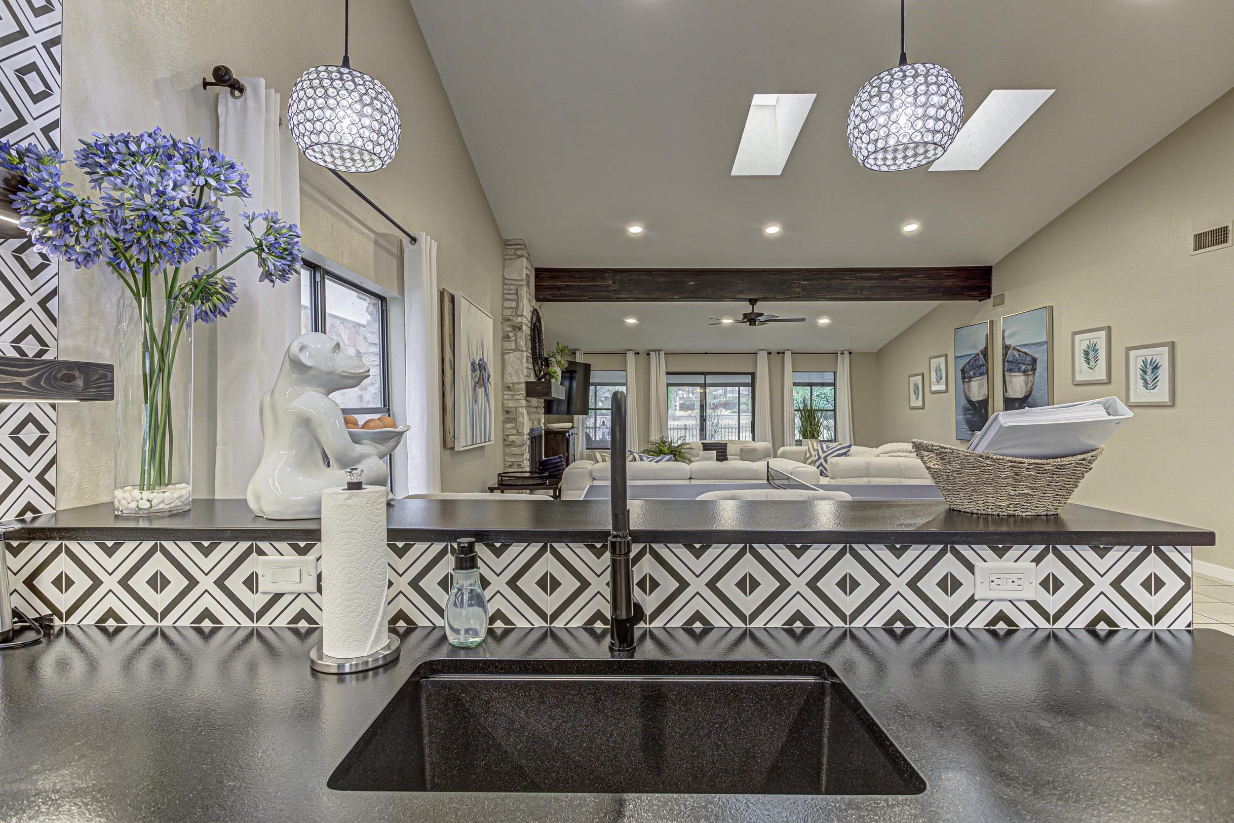 103 Oasis, Unit A Horseshoe Bay, TX 78657 - Photo 17 of 30 a view of hall way with furniture and chandelier