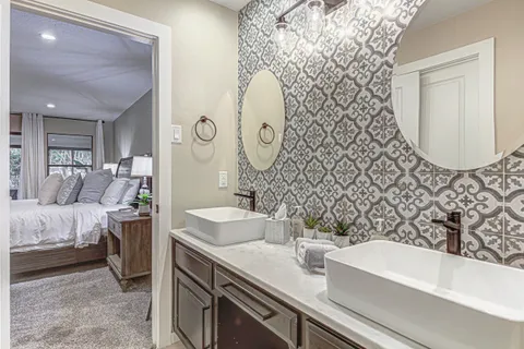 a bathroom with a sink and a mirror