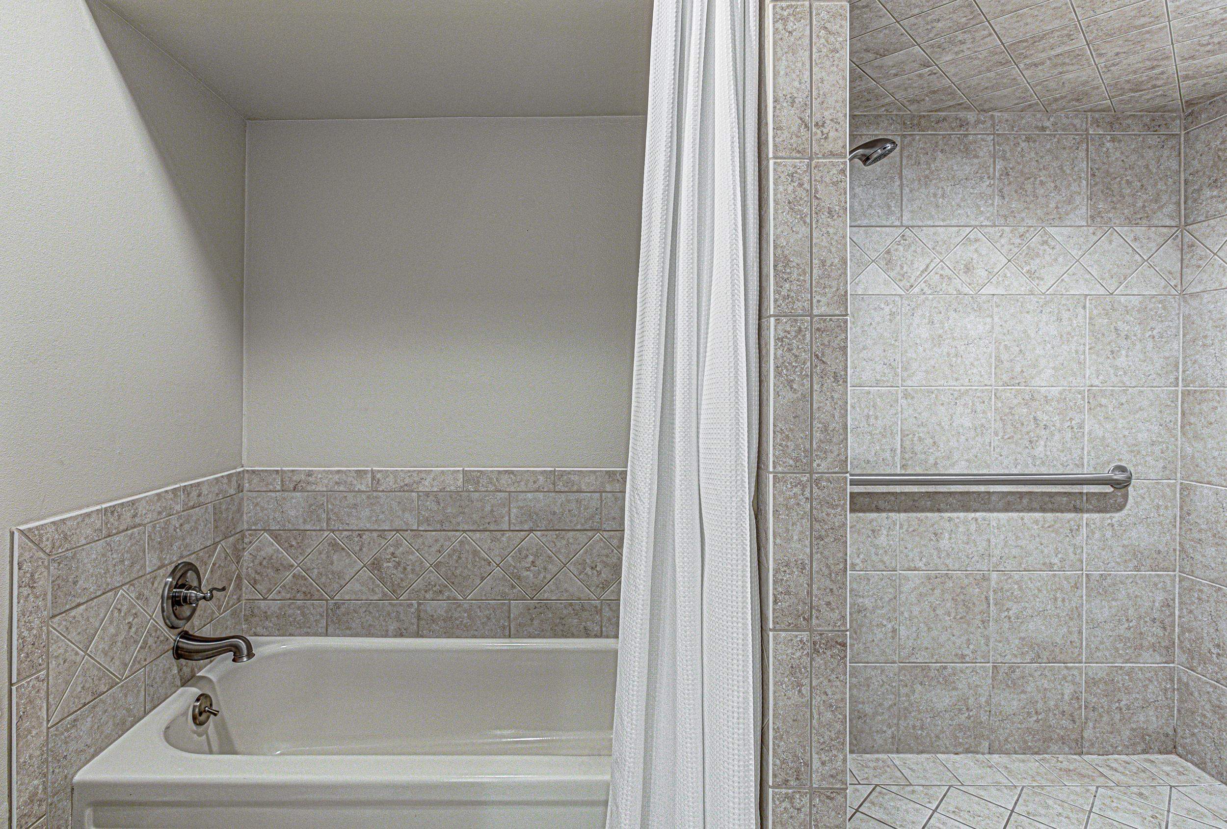 103 Oasis, Unit A Horseshoe Bay, TX 78657 - Photo 22 of 30 a bathroom with a bathtub