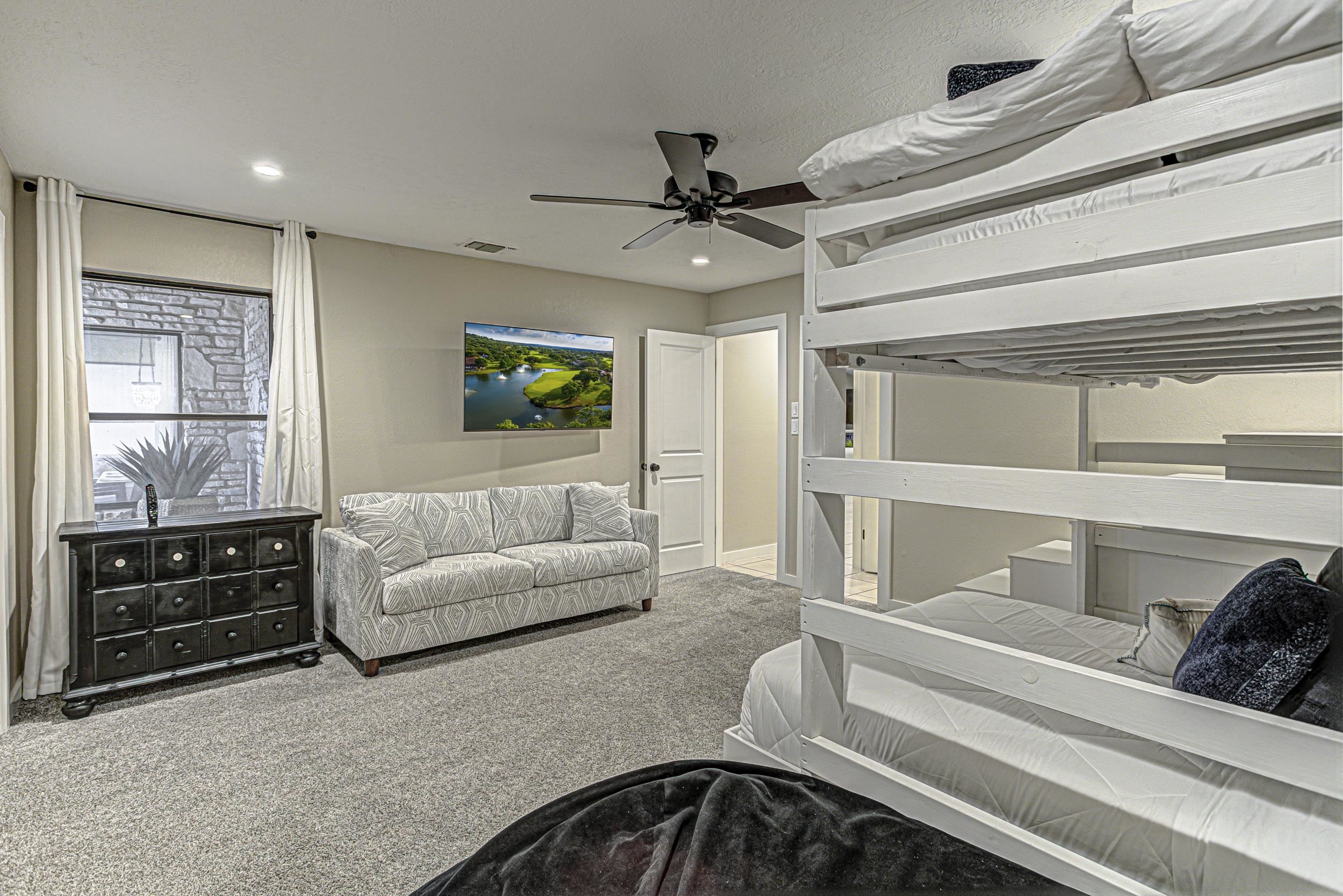 103 Oasis, Unit A Horseshoe Bay, TX 78657 - Photo 24 of 30 a living room with furniture and a flat screen tv