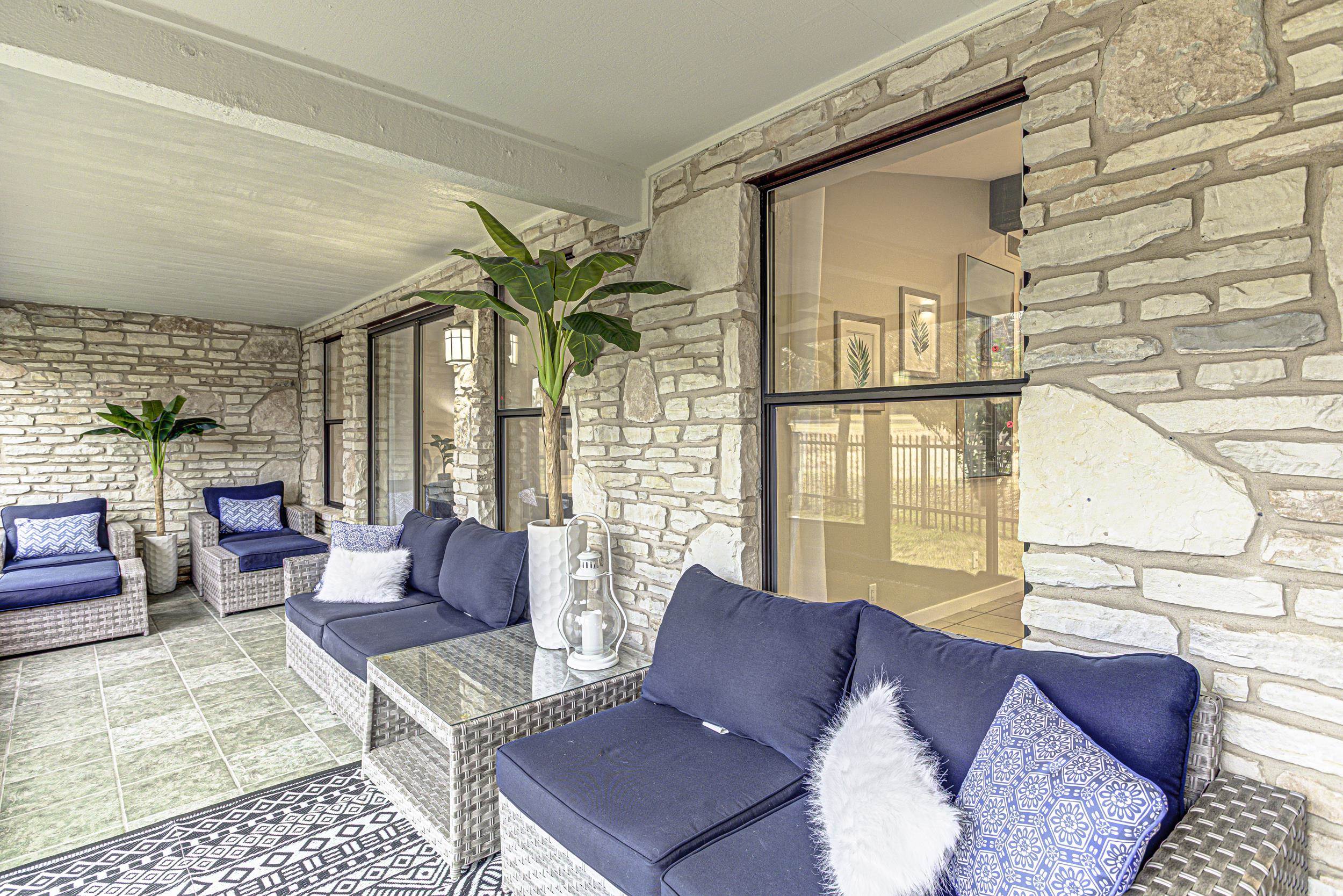 103 Oasis, Unit A Horseshoe Bay, TX 78657 - Photo 28 of 30 a living room with furniture and a large window