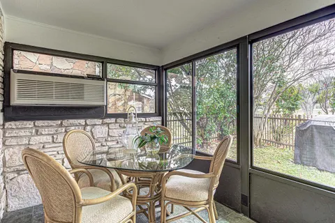 a view of a dining room with furniture window and outside view