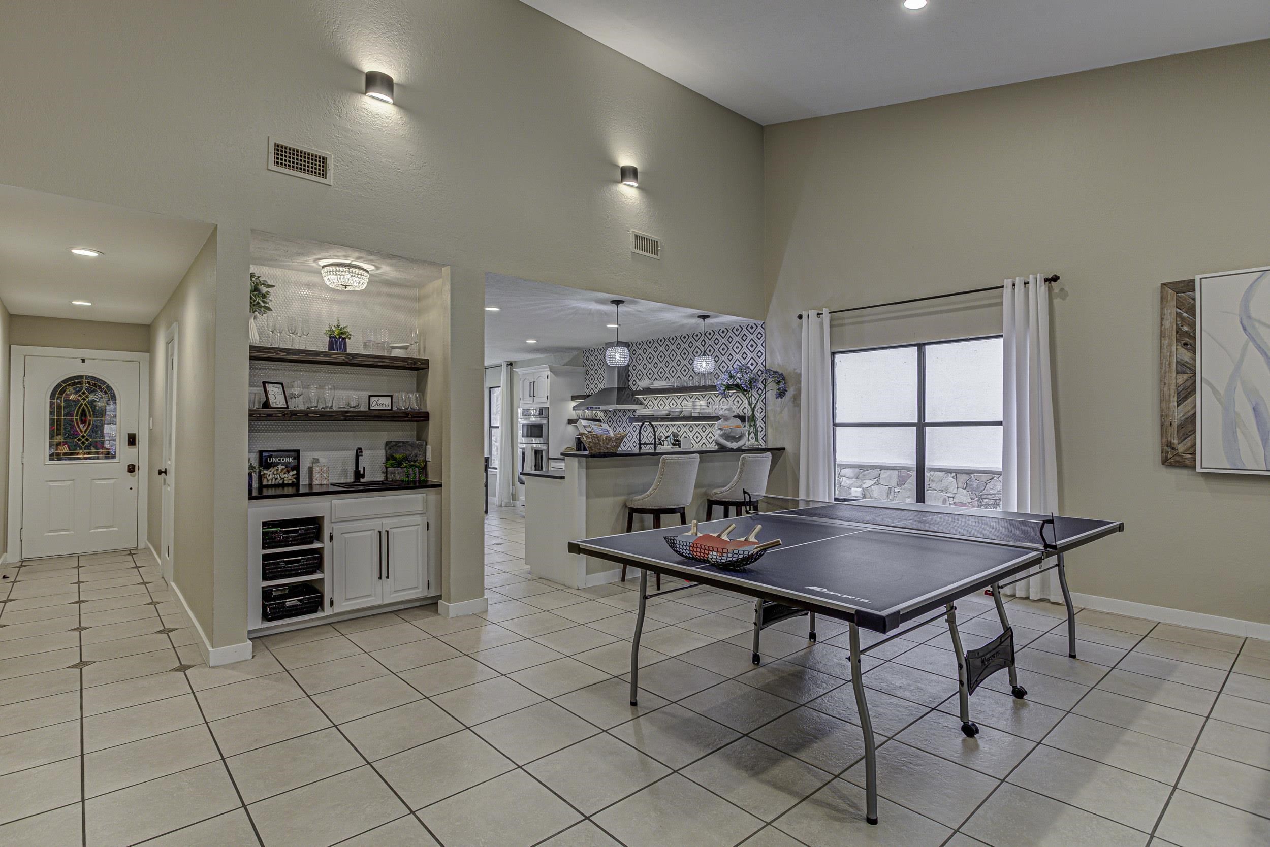 103 Oasis, Unit A Horseshoe Bay, TX 78657 - Photo 8 of 30 a kitchen with stainless steel appliances kitchen island granite countertop a sink and a refrigerator