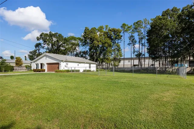 a kitchen with cabinets and window