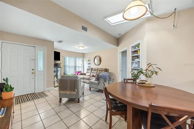 a view of a house with backyard and a patio