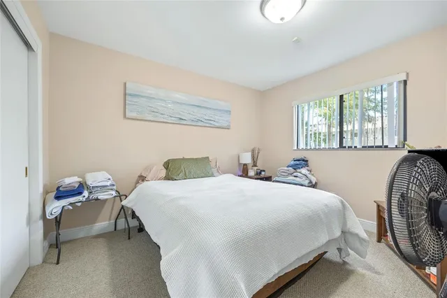 a view of a fountain in front of a house with a fountain