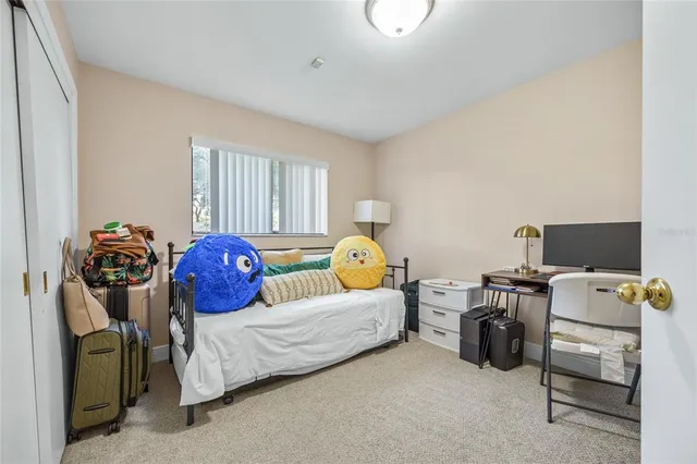 a view of backyard with wooden fence and a large tree