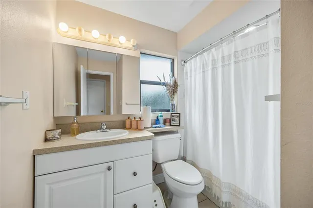 an aerial view of residential houses with outdoor space and swimming pool