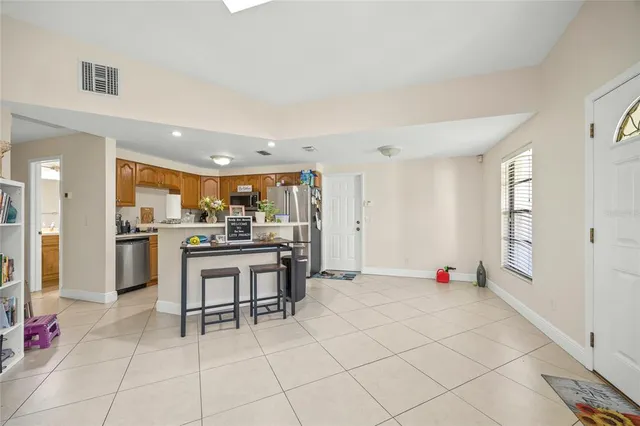 a bedroom with bed and a chandelier