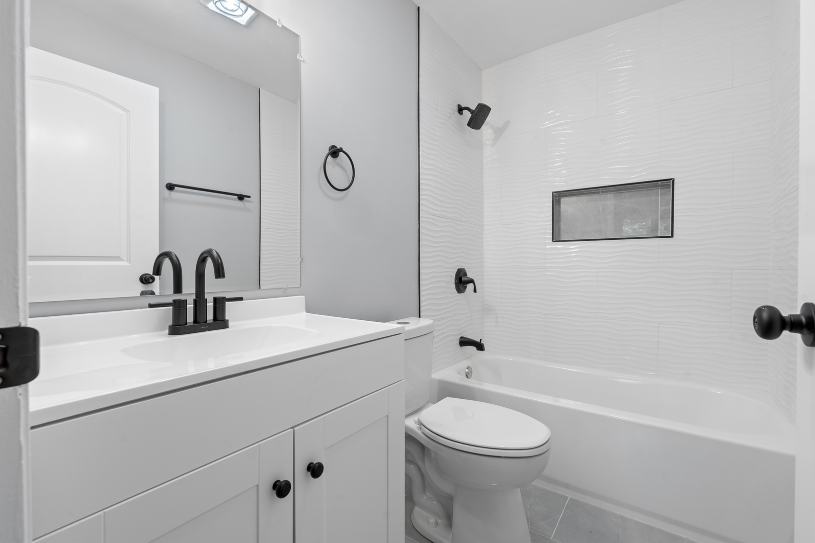 Undisclosed Address Hazel Crest, IL 60429 - Photo 14 of 23 a bathroom with a sink a toilet and a bathtub