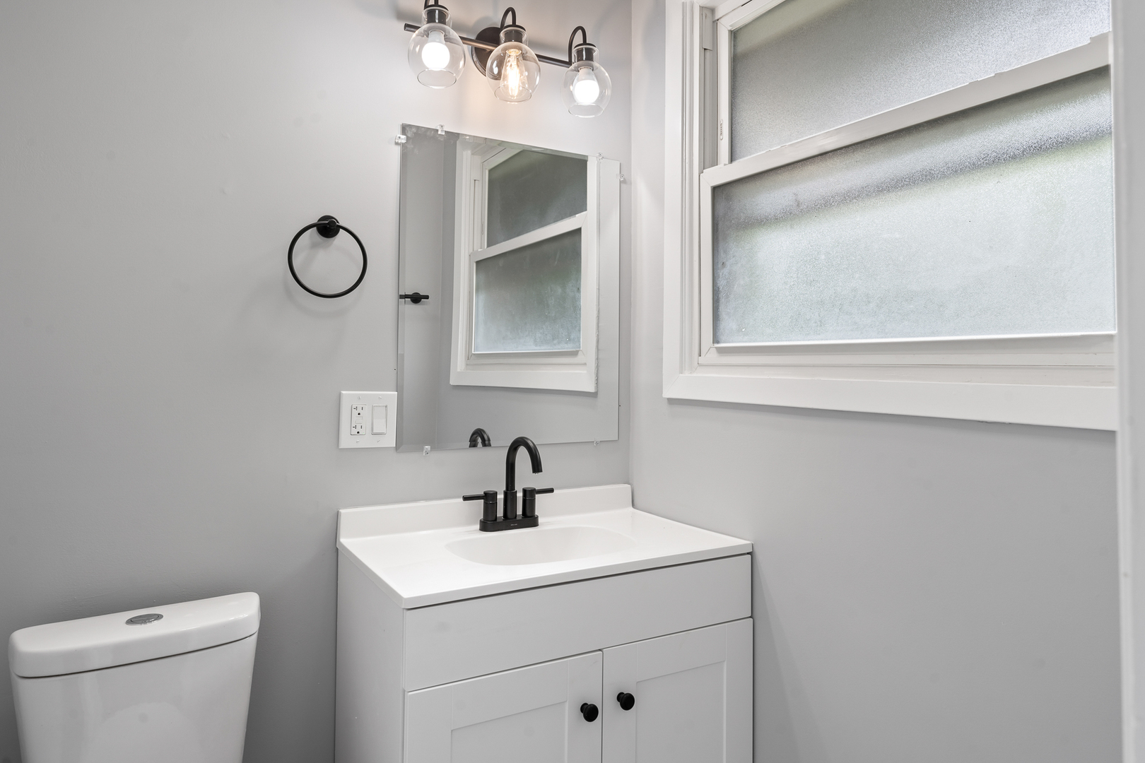 Undisclosed Address Hazel Crest, IL 60429 - Photo 18 of 23 a bathroom with a toilet sink and mirror